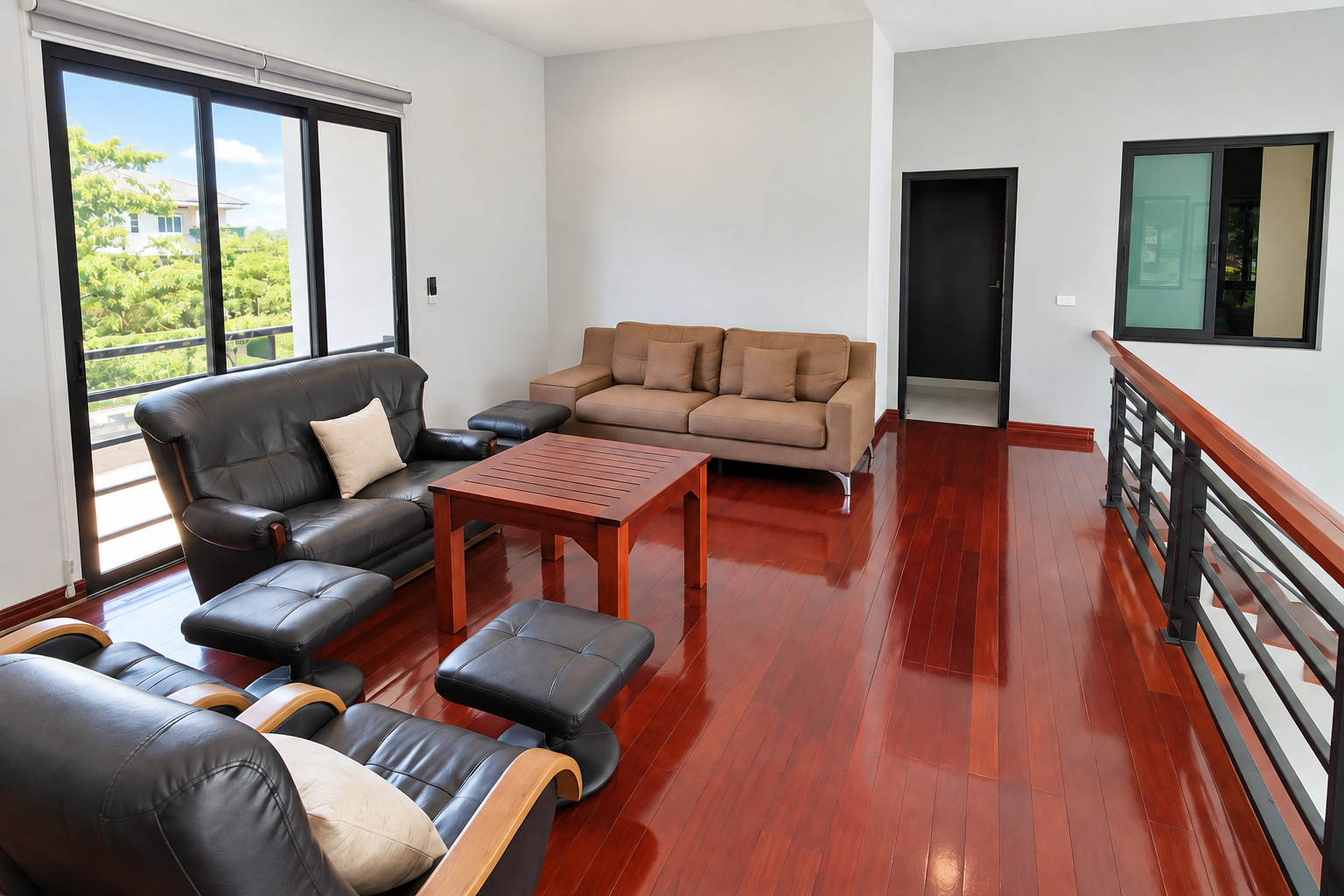 Upstairs lounge with wooden floor and balcony – villa for rent Vientiane