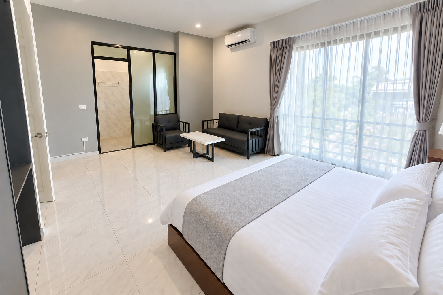 Air-conditioned bedroom with seating corner – 5-bedroom villa Vientiane