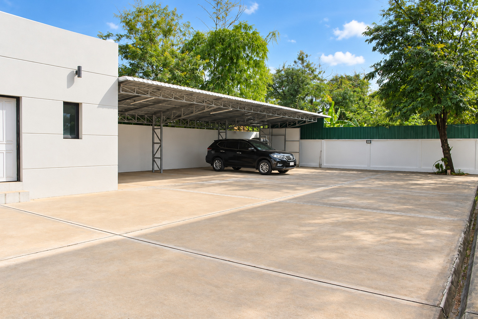 Covered carport and secure parking yard – villa Vientiane