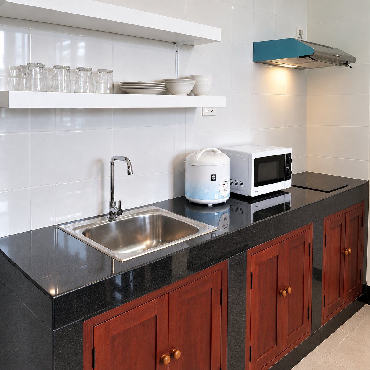 apartment-1-bedroom-city-center-vientiane-04-fitted-kitchen Fitted kitchen with microwave and induction hob, apartment for rent in Vientiane