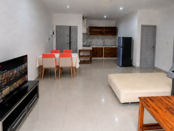 Open living and dining area of a serviced 2-bedroom apartment in Sisattanak, Vientiane