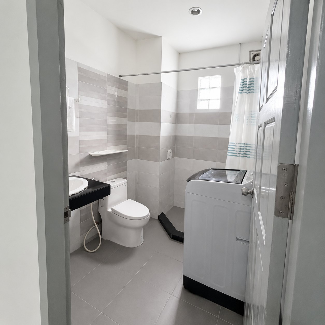 First bedroom with double bed and wardrobe in a 2-bedroom apartment in Vientiane