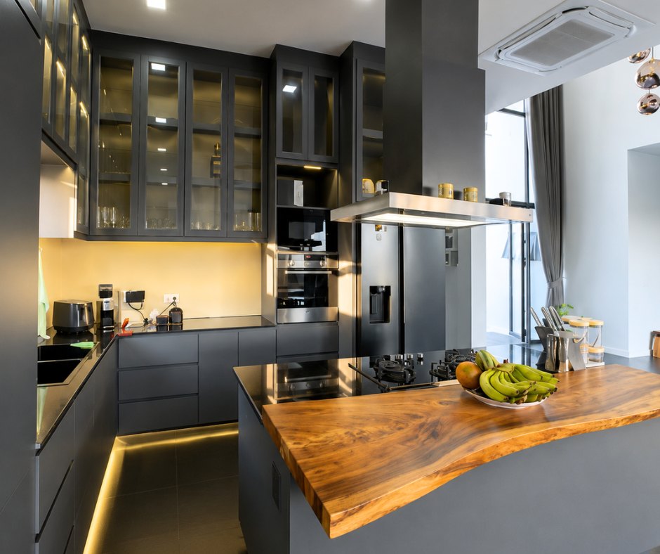 villa khamsavath vientiane fitted kitchen Fully equipped kitchen with island and dark cabinetry in a Vientiane villa