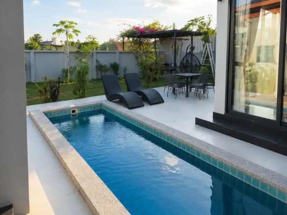 Private swimming pool and sun loungers at a 3-bedroom villa for rent in Vientiane