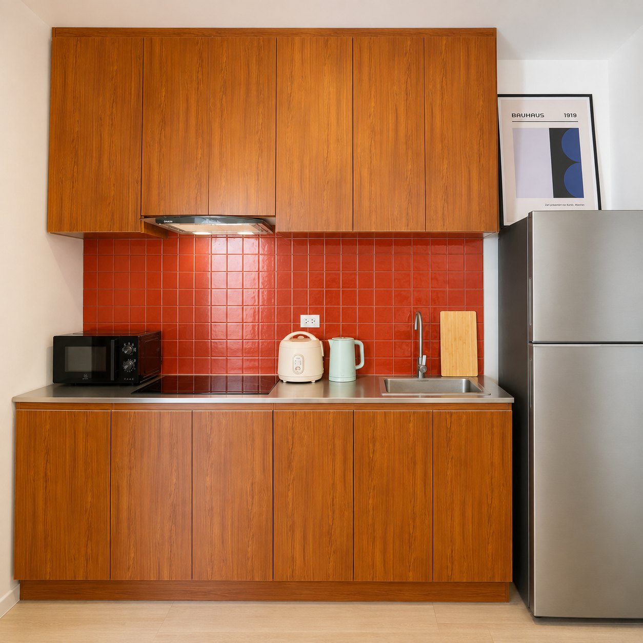 villa sisattanak vientiane fitted kitchen Fitted kitchen with wooden units, induction hob and fridge in a Vientiane rental villa