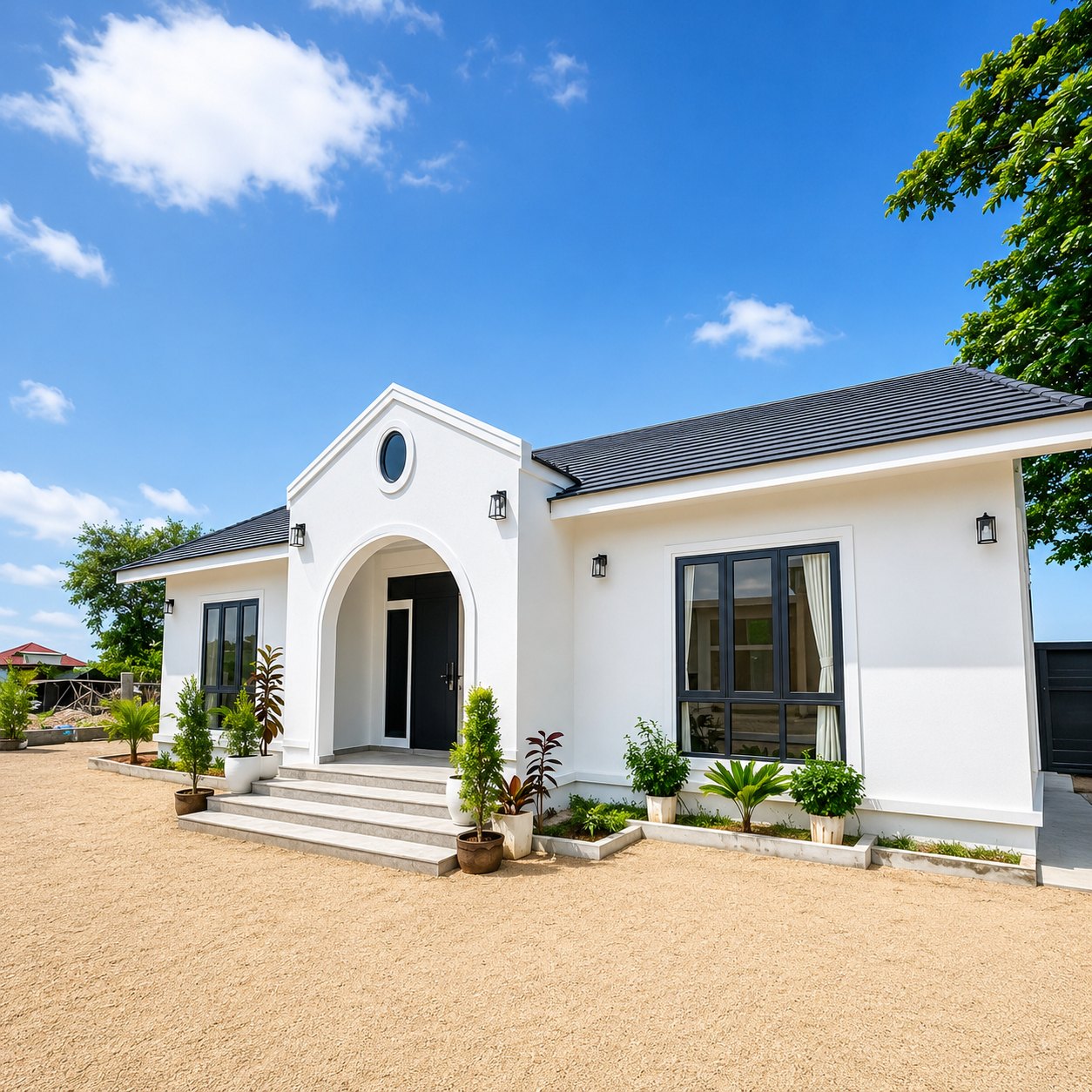Side view of a new modern villa with landscaped planters in southern Vientiane
