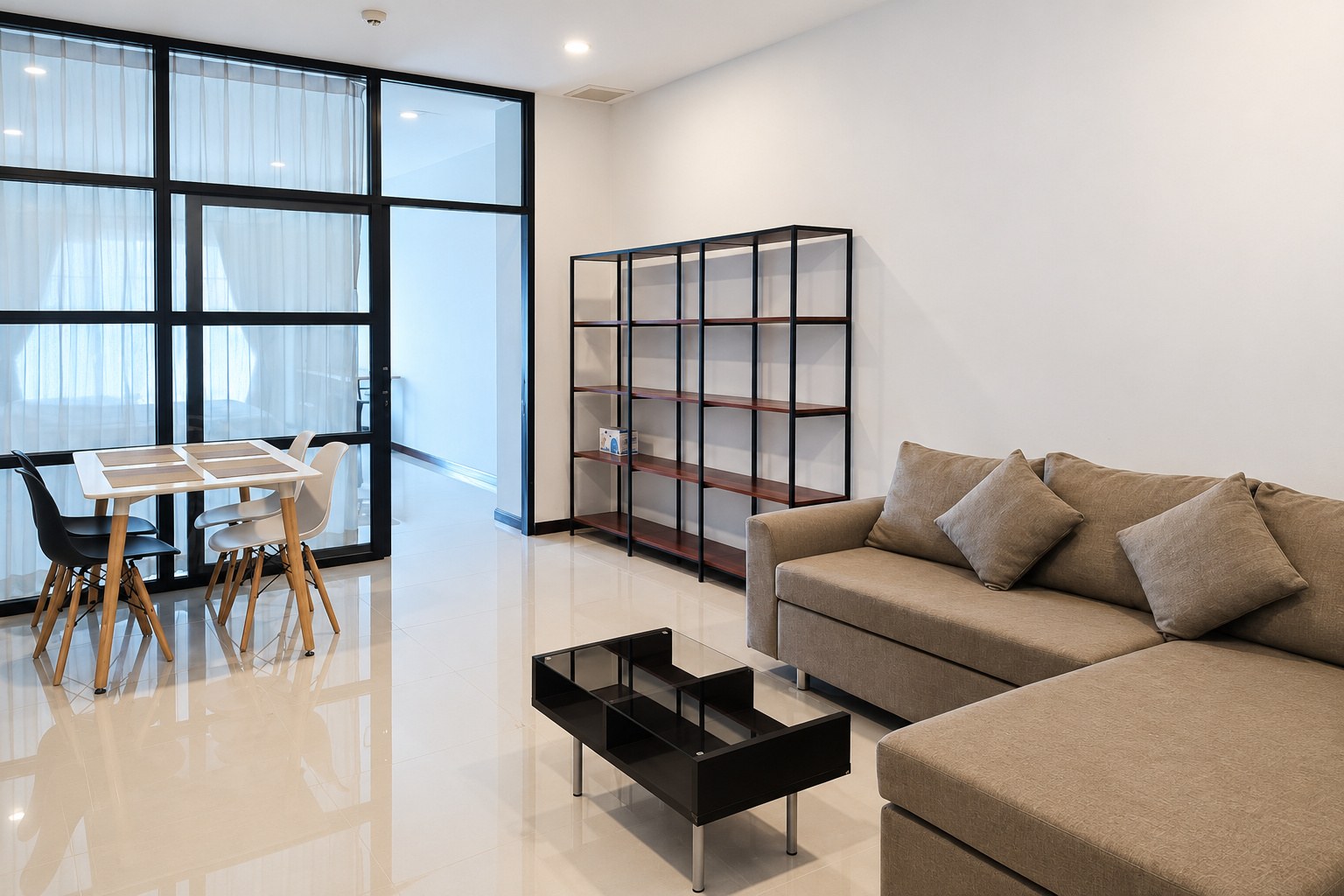 Living room with sofa and dining area – 1-bedroom apartment near VIS, Sisattanak, Vientiane