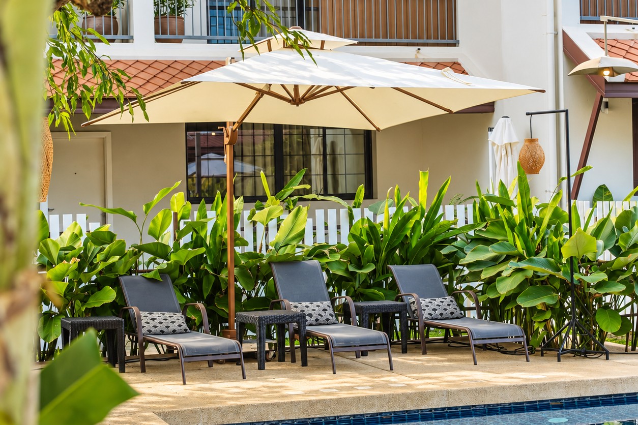 Poolside lounge area in tropical garden – Vientiane residence