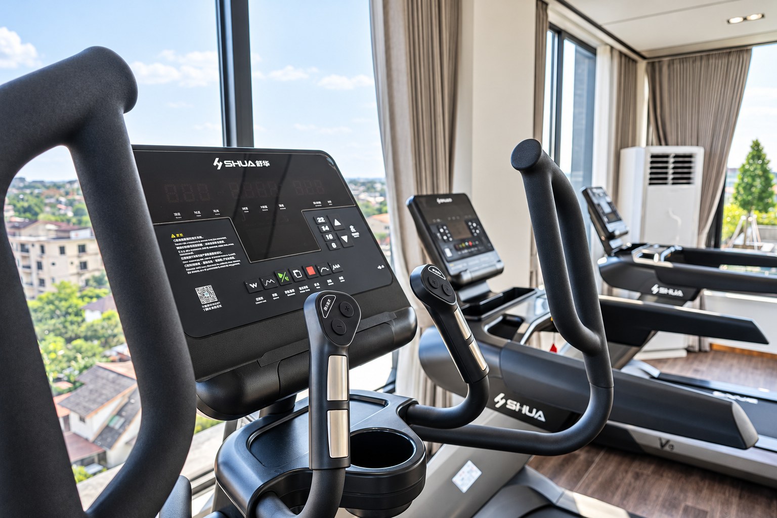 Fitness gym with city view at BeHome Apartment, Vientiane Fitness gym with city view at BeHome Apartment, Vientiane