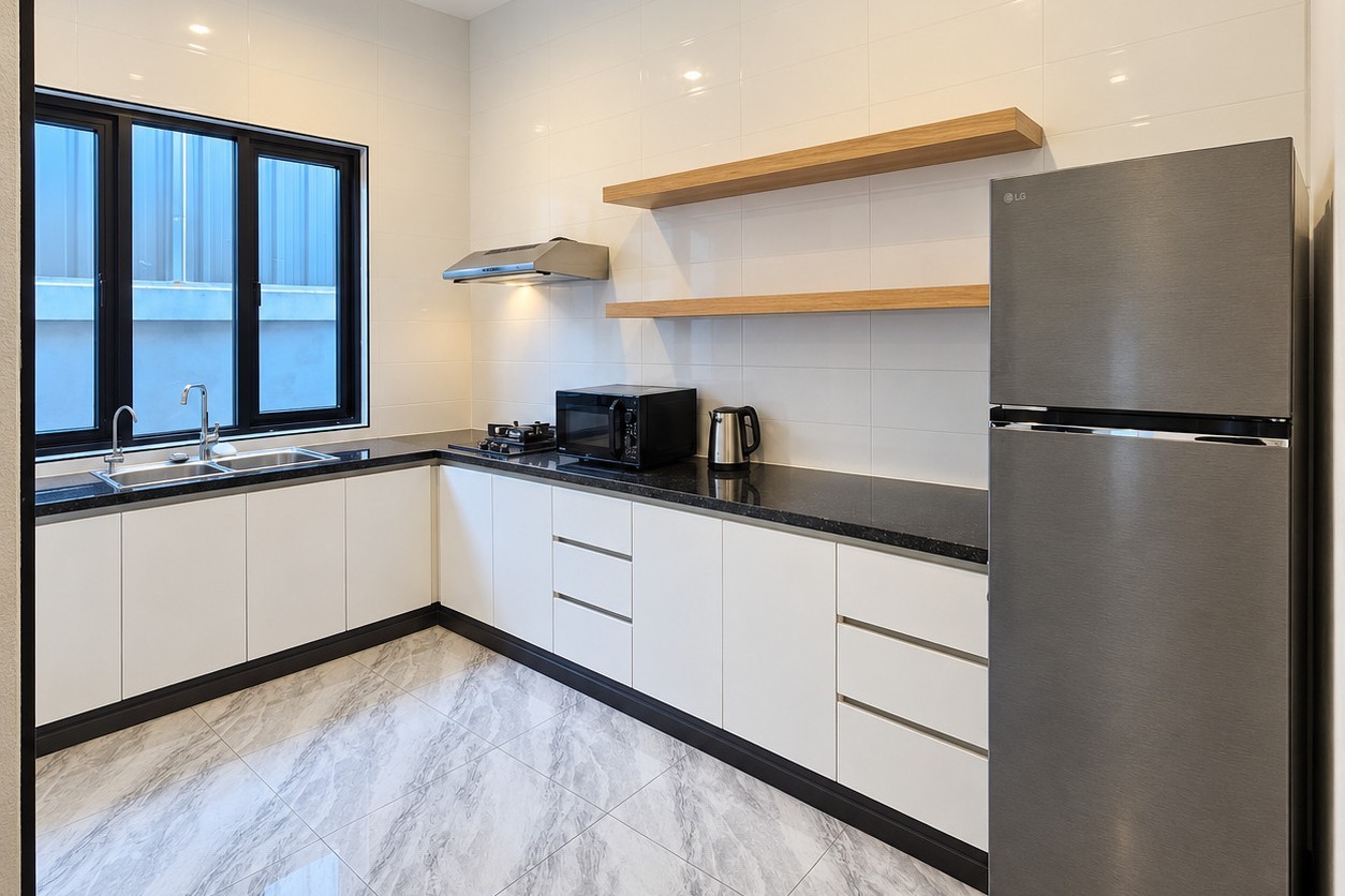 Fitted kitchen with fridge, microwave and gas hob – apartment Vientiane city center