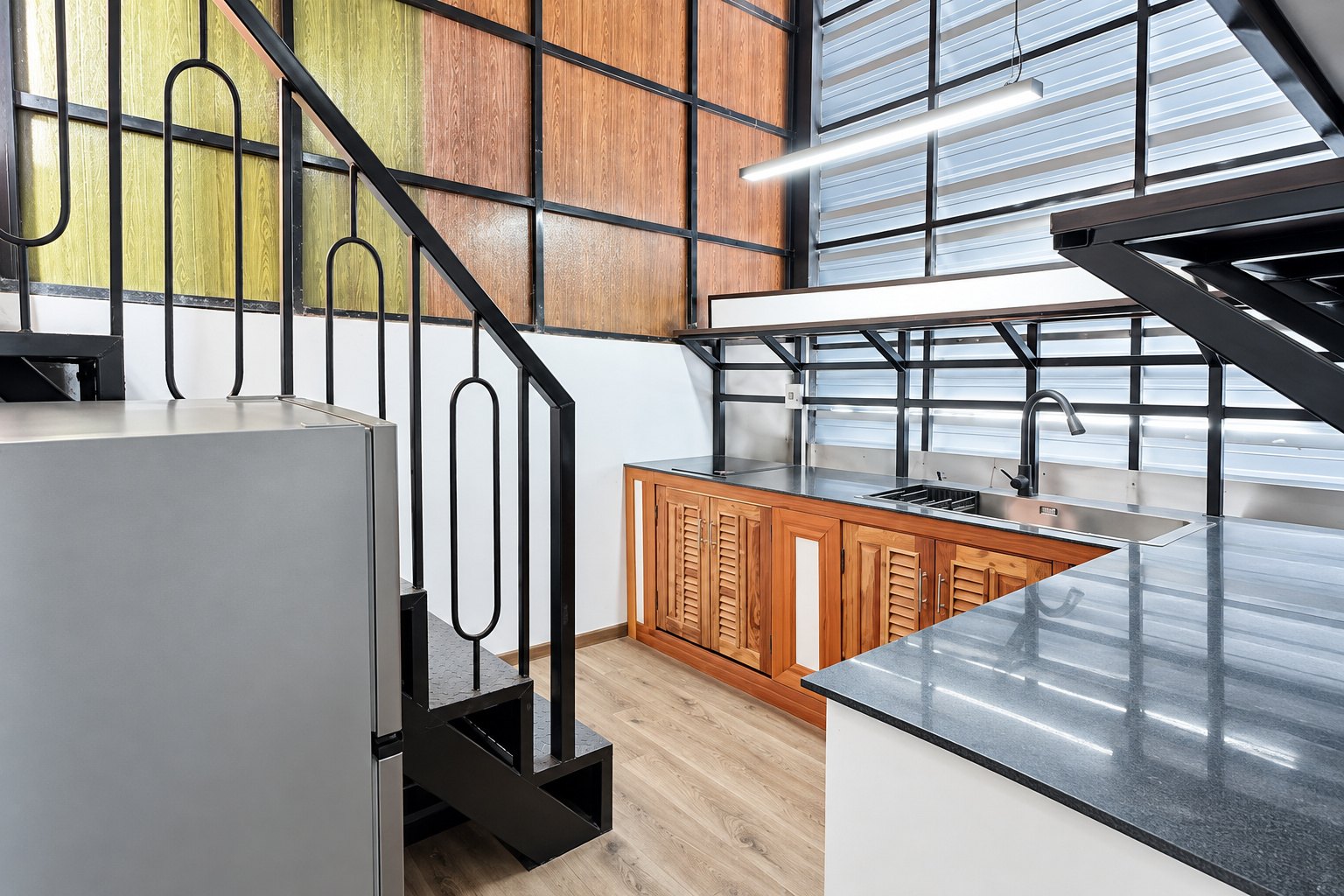Fitted kitchen with granite worktop and staircase – new apartment, city center, Vientiane