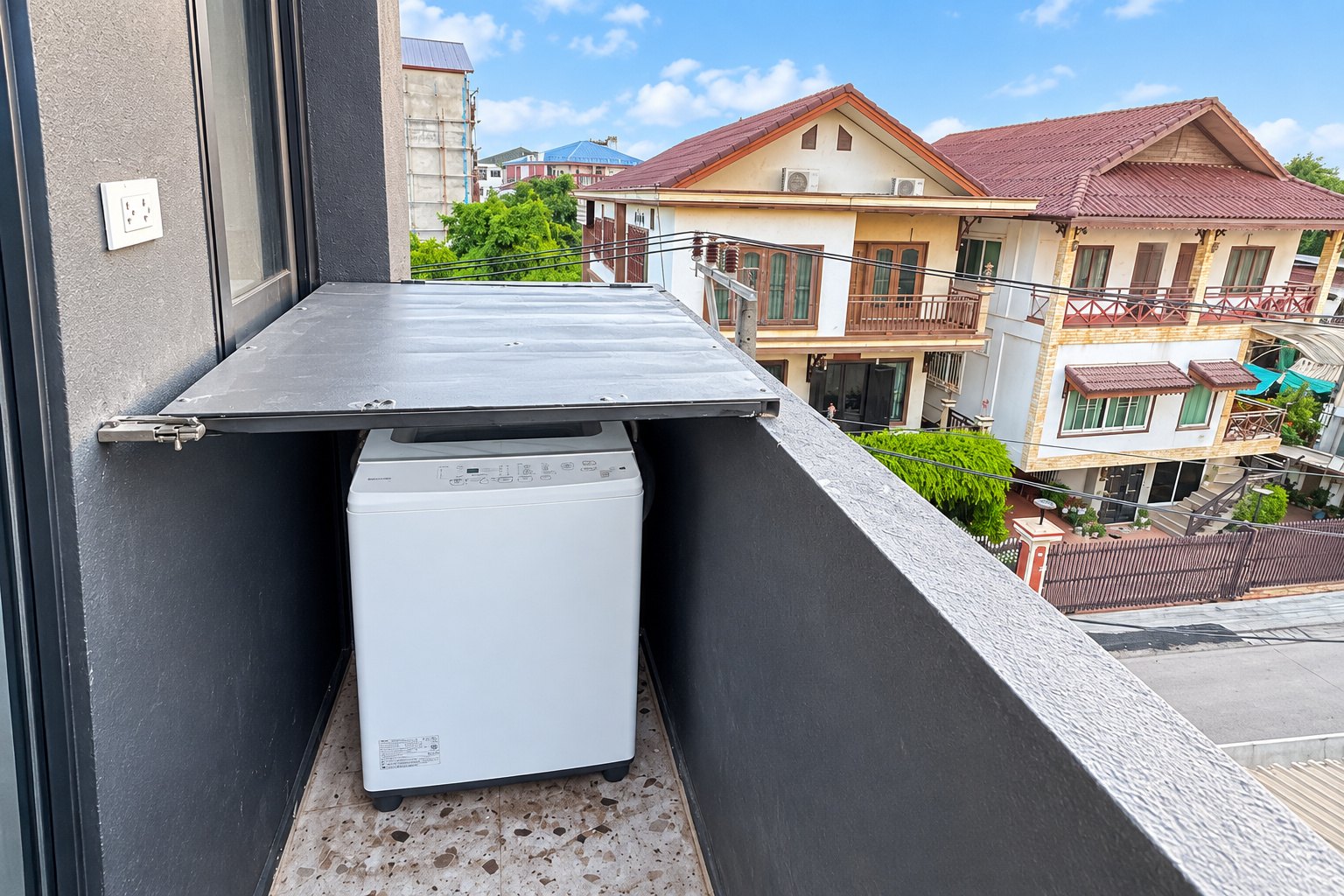 Balcony with washing machine – new apartment, city center, Vientiane