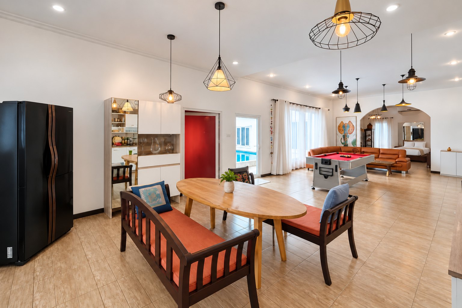 Dining area with oval table and fitted kitchen – near Khamsavath railway station, Vientiane
