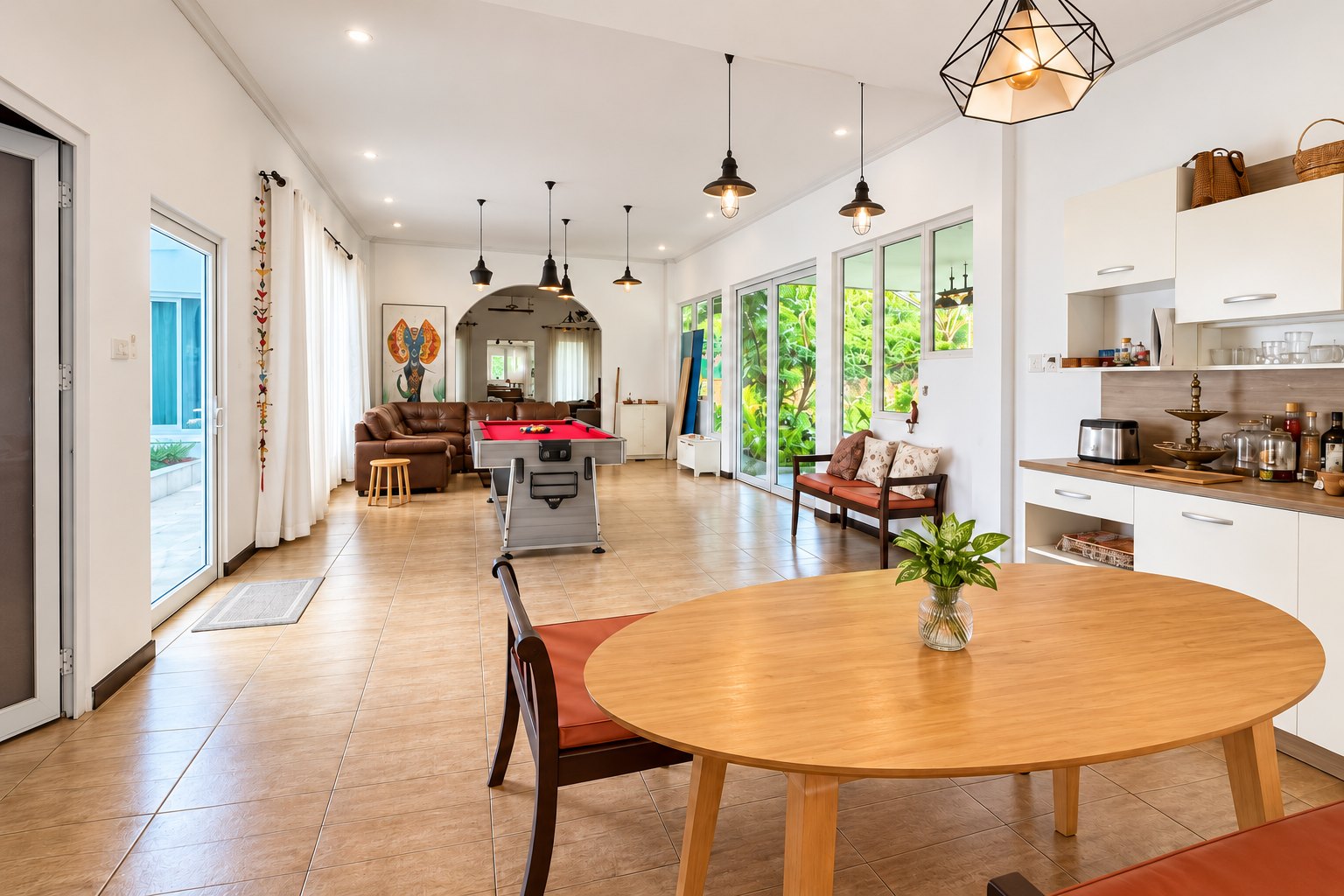 Kitchen with round dining table and garden view – near Khamsavath railway station, Vientiane