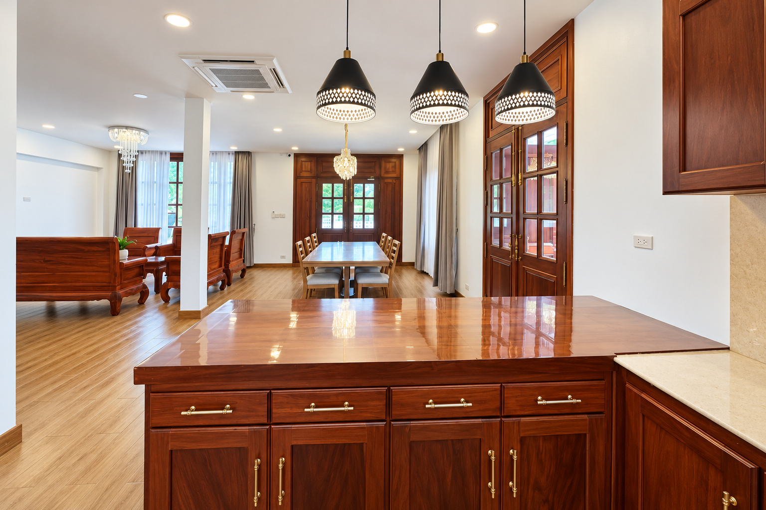 Kitchen breakfast bar opening onto the living area – new villa, Xaysettha, Vientiane